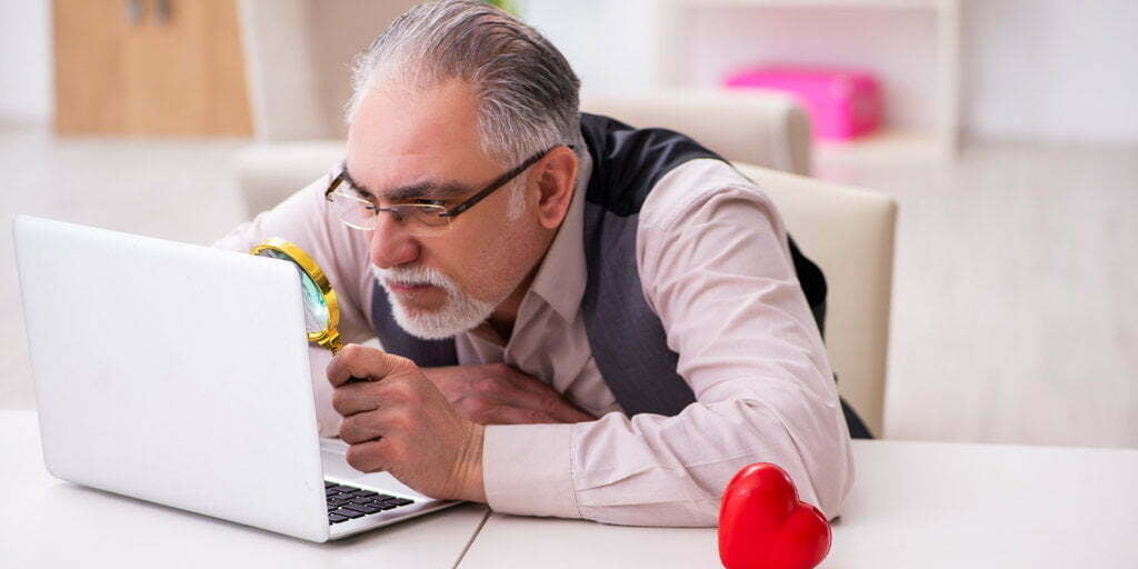 man with difficulty reading page text
